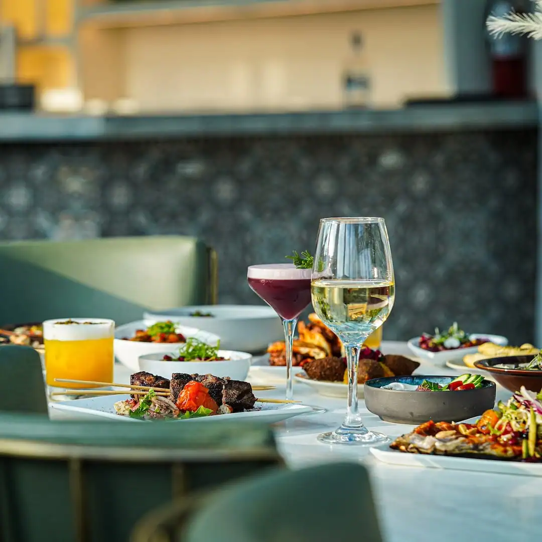 A spread of Middle Eastern dishes and shared plates.